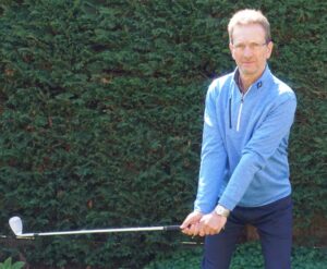tony holding a golf club